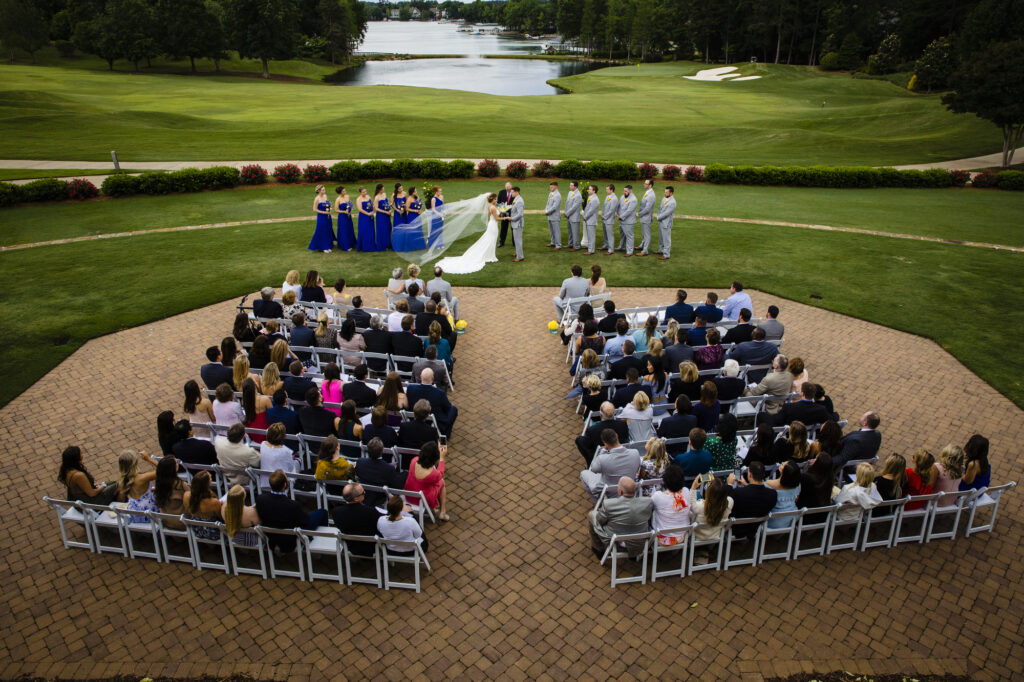 wedding ceremony in a golf field at the Peninsula Club Cornelius North Carolina