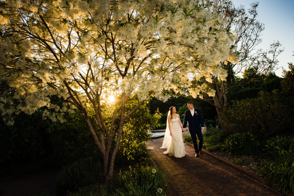 bride and groom walking in daniel stowe botanical gardens